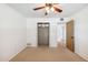 A bright bedroom features a closet with open doors to the room at 216 E Harmont Dr, Phoenix, AZ 85020