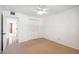 A bright bedroom features a closet and a door to the hall at 216 E Harmont Dr, Phoenix, AZ 85020