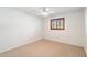 The bright bedroom has a window overlooking the community at 216 E Harmont Dr, Phoenix, AZ 85020