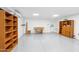 Spacious garage with shiny floors, shelving, and ample workspace at 216 E Harmont Dr, Phoenix, AZ 85020