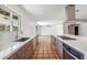 Spacious open-concept kitchen featuring stainless steel appliances and view of the living area and backyard at 216 E Harmont Dr, Phoenix, AZ 85020