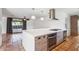 Modern kitchen featuring a large island, stainless steel appliances, and pendant lighting at 216 E Harmont Dr, Phoenix, AZ 85020