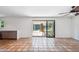 Bright living area with tiled flooring, a sliding glass door leading to the backyard at 216 E Harmont Dr, Phoenix, AZ 85020