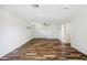 Spacious living room featuring wood-look tile, recessed lighting, and ample natural light at 216 E Harmont Dr, Phoenix, AZ 85020