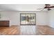 Bright living room area featuring Saltillo tile flooring and sliding doors opening to the backyard at 216 E Harmont Dr, Phoenix, AZ 85020
