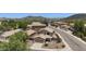 An aerial view shows the tan two-story home in a desert landscape at 2210 E Paraiso Dr, Phoenix, AZ 85024