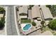 An aerial view of backyards featuring desert landscaping, backyard pools, covered patios and BBQ areas at 2210 E Paraiso Dr, Phoenix, AZ 85024