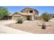 Tan two-story home boasts a desert landscaped front yard at 2210 E Paraiso Dr, Phoenix, AZ 85024