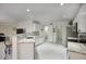 The kitchen features an open concept with white cabinets and a bar at 2210 E Paraiso Dr, Phoenix, AZ 85024