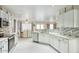 Open concept kitchen showcases white cabinets and stainless steel appliances at 2210 E Paraiso Dr, Phoenix, AZ 85024