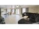 Spacious living room with tile floors open to kitchen and dining at 2210 E Paraiso Dr, Phoenix, AZ 85024