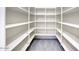 Walk-in pantry provides ample storage space with shelving and modern flooring for organization at 2210 E Paraiso Dr, Phoenix, AZ 85024