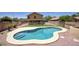 An inviting backyard pool with desert landscaping and easy access to outdoor entertaining areas at 2210 E Paraiso Dr, Phoenix, AZ 85024