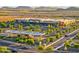 Aerial view showcasing a shopping center with ample parking, gas station, and beautiful landscaping at 2432 W Oberlin Way, Phoenix, AZ 85085