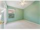 Bedroom featuring plush carpeting, a window with blinds, and light green walls at 2432 W Oberlin Way, Phoenix, AZ 85085