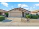 Charming single-story home showcasing manicured front yard, desert landscaping, and a two-car garage for comfortable living at 2432 W Oberlin Way, Phoenix, AZ 85085