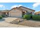 Charming single-story home showcasing manicured front yard, desert landscaping, and a two-car garage for comfortable living at 2432 W Oberlin Way, Phoenix, AZ 85085