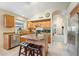 Inviting kitchen with an island, stainless steel appliances and a view into the living area for seamless entertaining at 2432 W Oberlin Way, Phoenix, AZ 85085