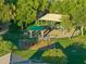 Aerial view of the community playground featuring mature trees, picnic tables, and a covered play area at 2432 W Oberlin Way, Phoenix, AZ 85085