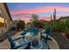Relaxing pool area featuring desert landscaping and comfortable seating with a beautiful sky at 2432 W Oberlin Way, Phoenix, AZ 85085