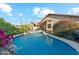 Inviting backyard pool with desert landscaping and a charming rock waterfall feature at 2432 W Oberlin Way, Phoenix, AZ 85085