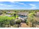 Beautiful aerial view of home with a private pool, desert landscaping, and blue skies at 26475 N Wrangler Rd, Scottsdale, AZ 85255