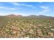 Expansive desert community aerial view, showcasing many homes and surrounding desert landscape at 26475 N Wrangler Rd, Scottsdale, AZ 85255