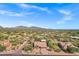 Expansive aerial view of a desert community with custom homes and breathtaking mountain vistas at 26475 N Wrangler Rd, Scottsdale, AZ 85255