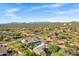 Wide angle aerial view of a desert community with mountain views in the background at 26475 N Wrangler Rd, Scottsdale, AZ 85255