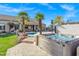 Backyard featuring a pool, hot tub, and desert landscaping, perfect for outdoor relaxation and entertainment at 26475 N Wrangler Rd, Scottsdale, AZ 85255