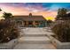 Tranquil backyard featuring a patio, mature landscaping, and a seamless blend of relaxation and sophistication at 26475 N Wrangler Rd, Scottsdale, AZ 85255