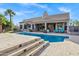Private backyard featuring pool, lounge, and covered patio areas at 26475 N Wrangler Rd, Scottsdale, AZ 85255