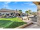 Expansive backyard featuring a pool, hot tub, and lush landscaping, perfect for outdoor relaxation and entertainment at 26475 N Wrangler Rd, Scottsdale, AZ 85255