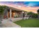 Charming backyard with a covered patio, lush landscaping, and serene atmosphere, ideal for relaxing and enjoying nature at 26475 N Wrangler Rd, Scottsdale, AZ 85255