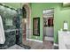 Bathroom featuring a glass shower, plus views into the closet and hallway at 26475 N Wrangler Rd, Scottsdale, AZ 85255