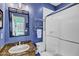 Beautiful blue bathroom with walk in shower and granite countertops at 26475 N Wrangler Rd, Scottsdale, AZ 85255