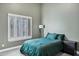 Cozy bedroom with wood-look floors, plantation shutters, and neutral decor at 26475 N Wrangler Rd, Scottsdale, AZ 85255