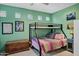Cozy bedroom with bunk beds, a wooden trunk, and a view through square windows at 26475 N Wrangler Rd, Scottsdale, AZ 85255