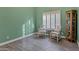 Spare bedroom offers wood-look tile floor, shuttered window, and seating at 26475 N Wrangler Rd, Scottsdale, AZ 85255