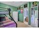 Fun bedroom featuring a bunk bed, colorful artwork, and ensuite bathroom entrance at 26475 N Wrangler Rd, Scottsdale, AZ 85255