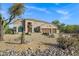 Beautiful home with desert landscaping and a three-car garage at 26475 N Wrangler Rd, Scottsdale, AZ 85255