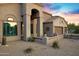 Close up front exterior view of a home with desert landscaping and stucco details at 26475 N Wrangler Rd, Scottsdale, AZ 85255