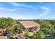Aerial view of the guest house including outdoor living area and landscaping at 26475 N Wrangler Rd, Scottsdale, AZ 85255