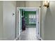 Hallway view looking into a room featuring green walls and wood-look tile flooring throughout at 26475 N Wrangler Rd, Scottsdale, AZ 85255