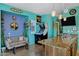 Stylish kitchen with bar, arcade game, gray sofa, and granite countertop at 26475 N Wrangler Rd, Scottsdale, AZ 85255