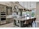 Well-appointed kitchen with marble counters, stone accents, and stainless steel appliances at 26475 N Wrangler Rd, Scottsdale, AZ 85255