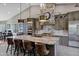 Modern kitchen featuring a marble island, stone accents, and stainless steel appliances at 26475 N Wrangler Rd, Scottsdale, AZ 85255
