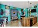 Eclectic living room with a gray sofa, arcade game, tile floor, and kitchen island with granite countertop at 26475 N Wrangler Rd, Scottsdale, AZ 85255