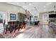 Spacious living area features an open kitchen, dining space, and fireplace at 26475 N Wrangler Rd, Scottsdale, AZ 85255