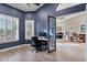 Bright office space with plantation shutters and an open view to the dining and living areas at 26475 N Wrangler Rd, Scottsdale, AZ 85255